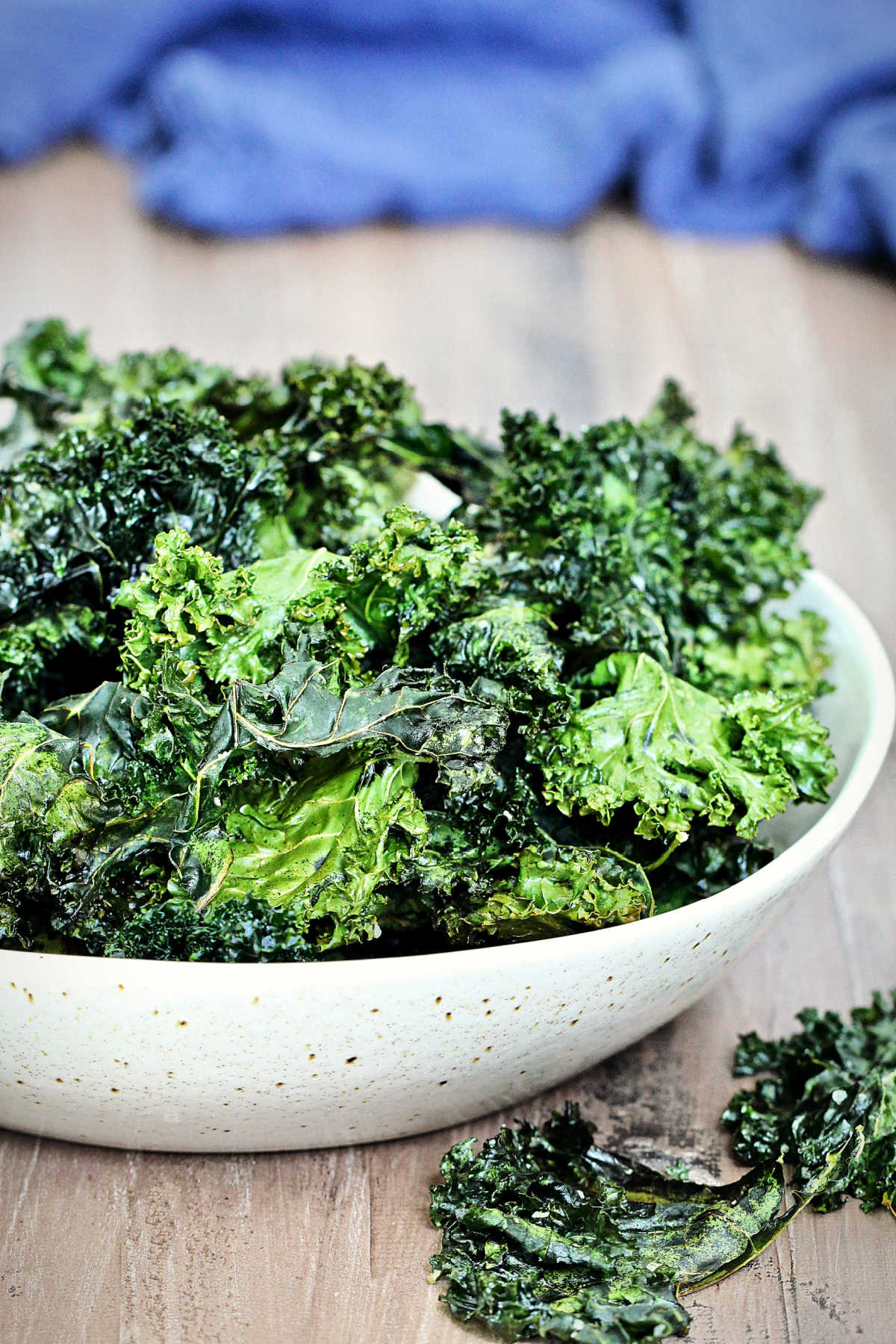 Kale chips in a white bowl.