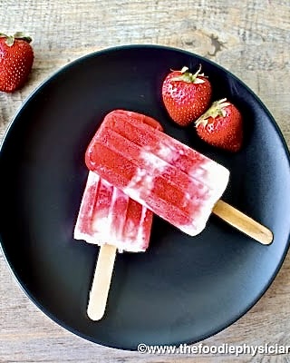 popsicles on a black plate