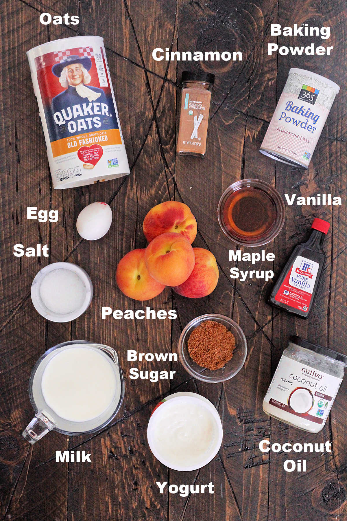 Ingredients for peach baked oatmeal on a wooden board.