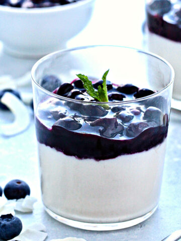 Coconut Panna Cotta with Blueberry Sauce in a glass