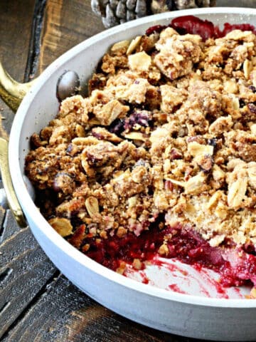 Berry crisp with a spoonful scooped out