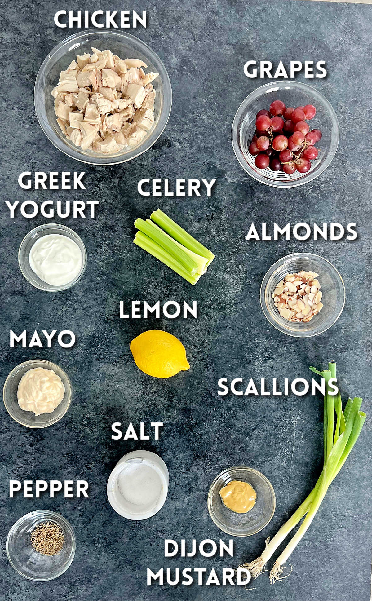 Ingredients for making chicken salad with grapes and almonds.