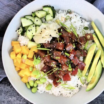 Overhead picture of a Spicy Tuna Poke Bowl in a white bowl.