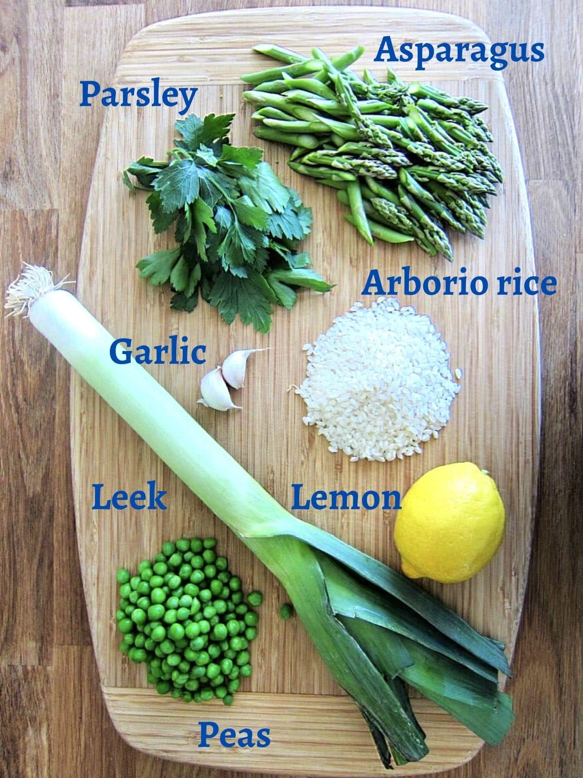 ingredients for lemon risotto on a wooden board