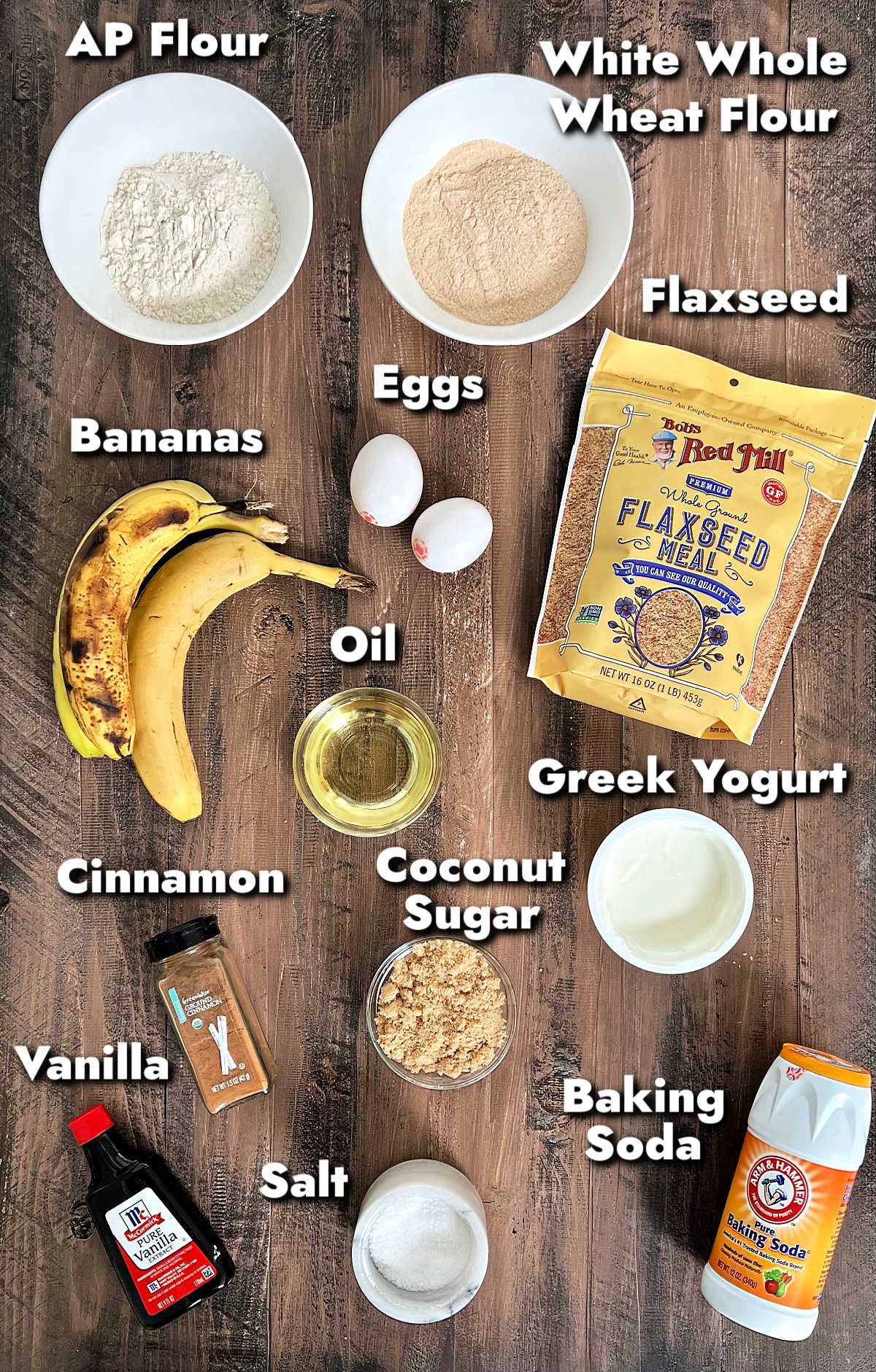 Ingredients for banana flaxseed bread on a wooden board.