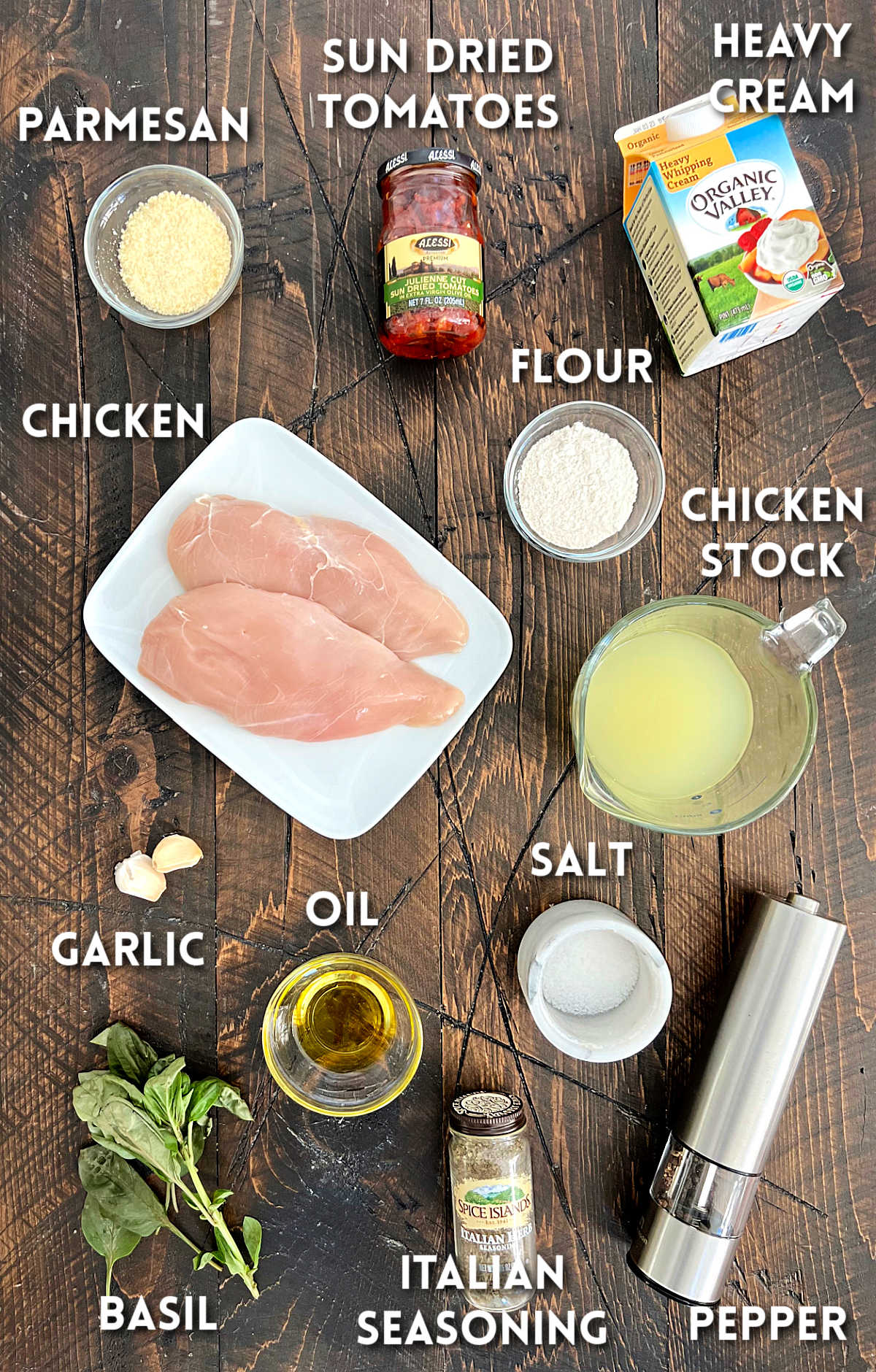 Ingredients for marry me chicken on a wooden board.