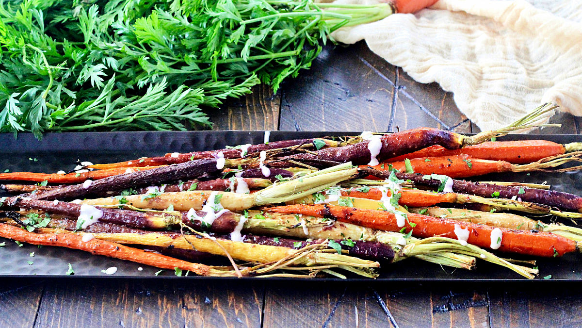 Miso roasted carrots on a long serving platter. 