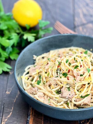 Tuna pasta in a dark gray bowl.
