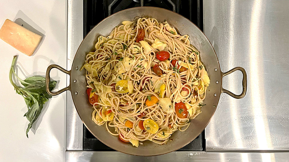 Mediterranean pasta in a skillet.