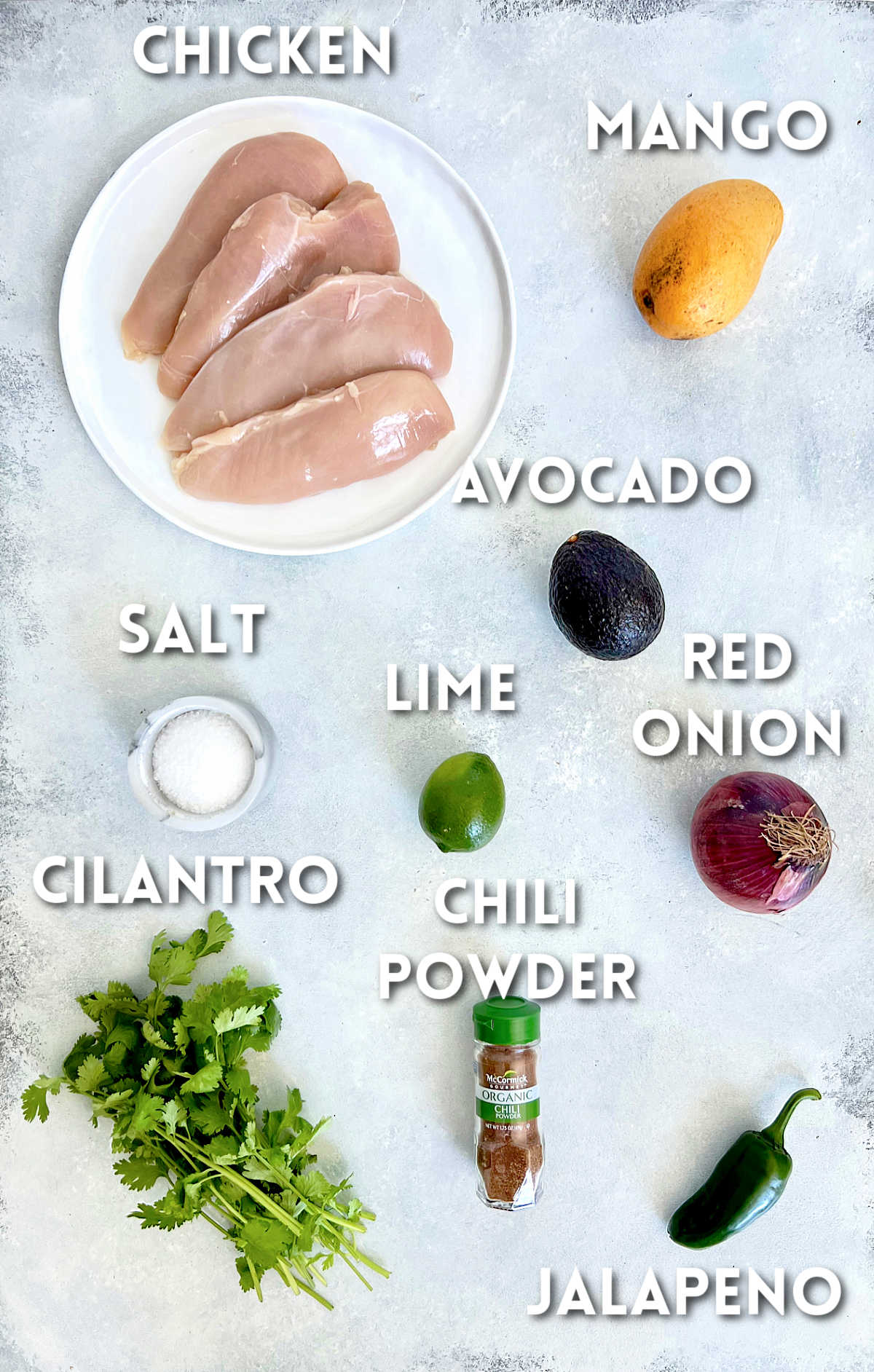 Ingredients for making grilled chicken with mango avocado salsa.