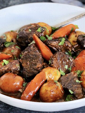 Classic Dutch Oven Beef Stew in a white bowl.